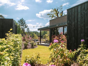 Modern lodge on the water and nature reserve Kwintelooijen